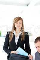 Beautiful businesswoman preparing her briefcase