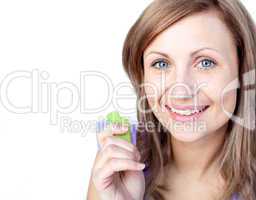 Radiant young woman eating celery