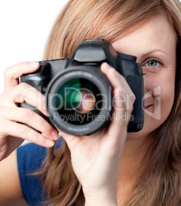Smiling woman using a camera