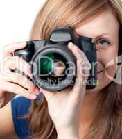 Smiling woman using a camera