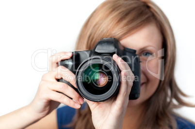 Attractive woman using a camera