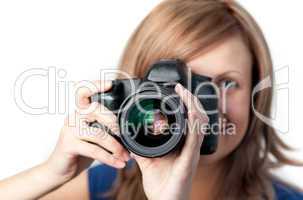 Attractive woman using a camera