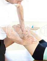 Young woman receiving a leg massage