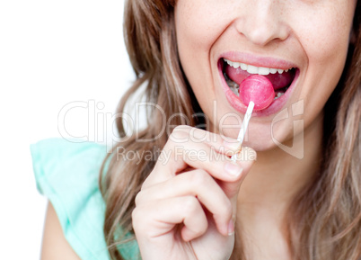 Close-up of a woman eating a lollipop