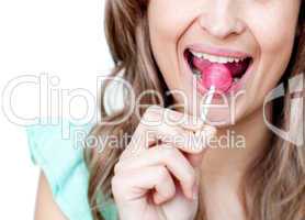 Close-up of a woman eating a lollipop
