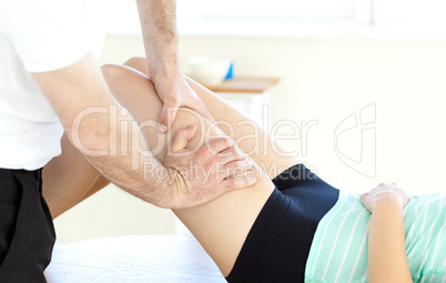 Close-up of a woman receiving a leg massage