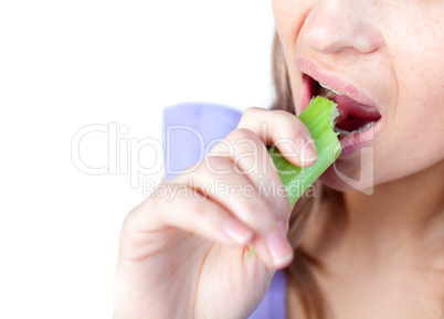 Close-up of a woman eating celery