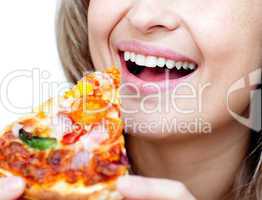 Close-up of a smiling woman eating a pizza