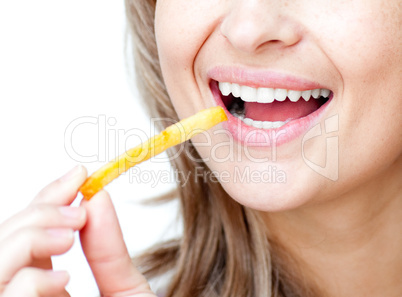 Close-up of a smiling woman eating fries