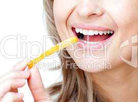 Close-up of a smiling woman eating fries