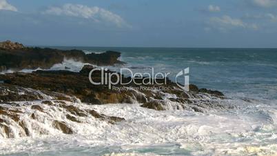 Sea waves against rocks on coast
