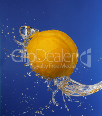 Splash in water with an orange