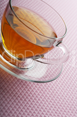 Tea cup on pink background