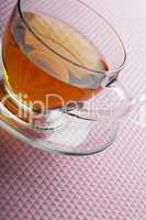 Tea cup on pink background