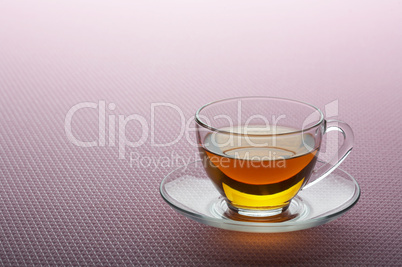 Tea cup on pink background