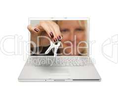Woman Handing House Keys Through Laptop Screen