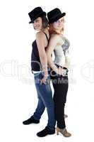 Two ladies with hats on a white background