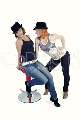 Two ladies with hats on a white background