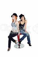 Two ladies with hats on a white background