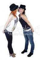 Two ladies with hats on a white background