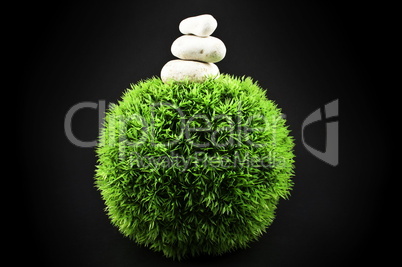 Three stones and grass ball
