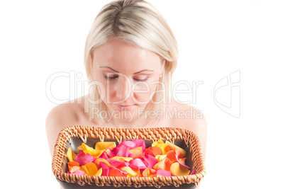 Woman and petals on the plate