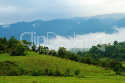 landscape view with mountains and fog
