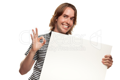 Fun Young Man Holding Blank White Sign