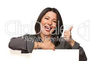 Multiethnic Woman Leaning on Blank White Sign with Thumbs Up