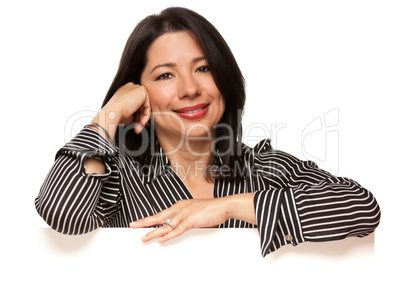 Attractive Multiethnic Woman Leaning on Blank White Sign Corner