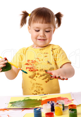 Cute child paint her fingers