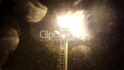 Floodlight and falling snow
