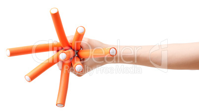 Hand with bunch of curlers