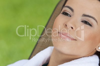 Beautiful Hispanic Woman in White Bathrobe At Health Spa