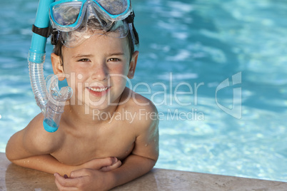 Happy Boy In Swimming Pool With Blue Goggles and Snorkel