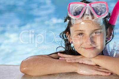 Happy Girl Child In Swimming Pool with Goggles and Snorkel