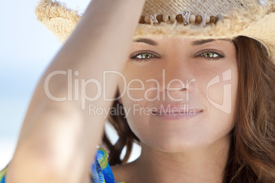 Outdoor Portrait of Woman With Green Eyes Wearing Cowboy Hat