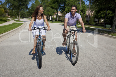 Romantic Man and Woman Couple Cycling Together