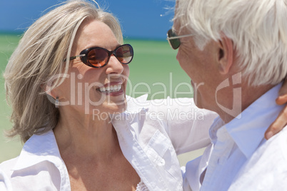 Happy Senior Couple Dancing Holding Hands on A Tropical Beach