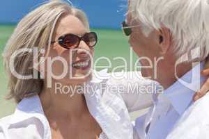 Happy Senior Couple Dancing Holding Hands on A Tropical Beach