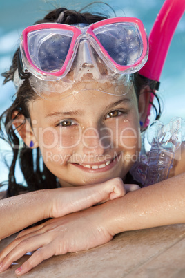 Happy Girl Child In Swimming Pool with Goggles and Snorkel