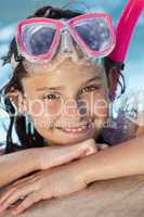 Happy Girl Child In Swimming Pool with Goggles and Snorkel