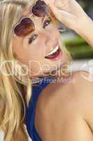 Beautiful Laughing Blond Woman In Heart Shaped Sunglasses