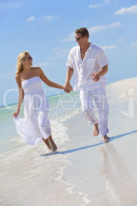 Happy Young Couple Running Holding Hands on A Tropical Beach