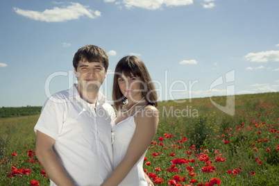 Boy and girl posing in the middle of nature