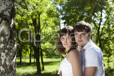 Woman and man posing in the middle of nature