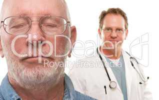 Concerned Senior Man with Doctor Behind