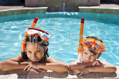 Boy and Girl In Swimming Pool with Goggles & Snorkel