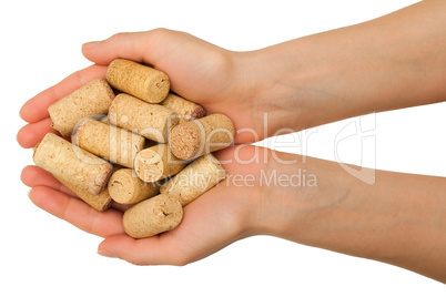 Hands with wine corks