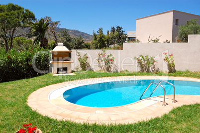 Grill at swimming pool by luxury villa, Crete, Greece